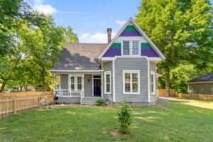 Restored Victorian-style home with colorful trim in Northwest Arkansas